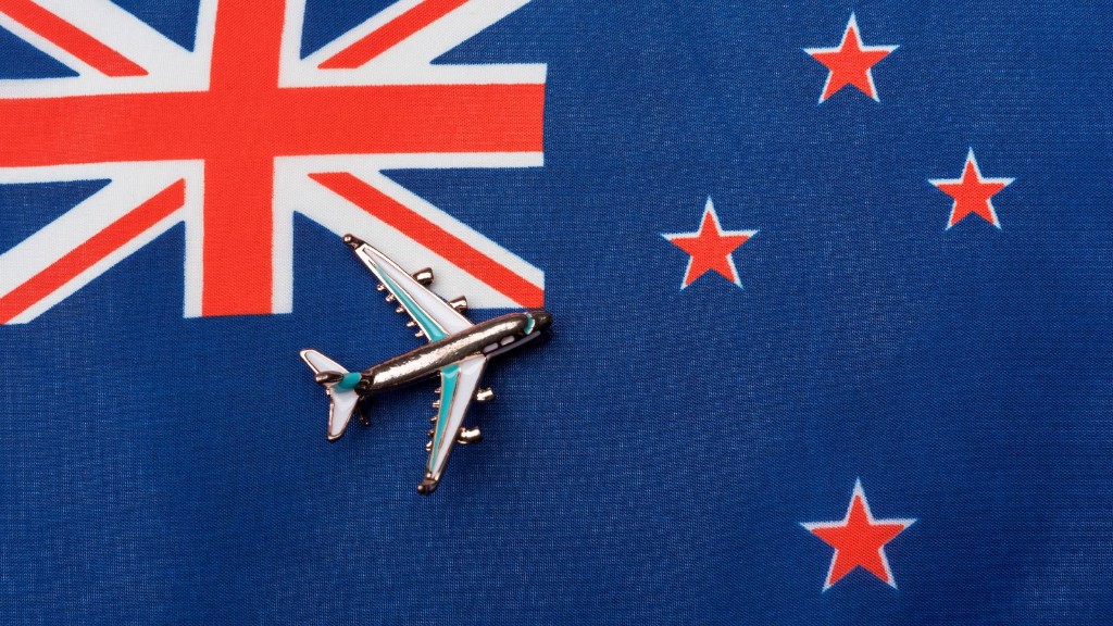 New Zealand flag with passport and visa application documents